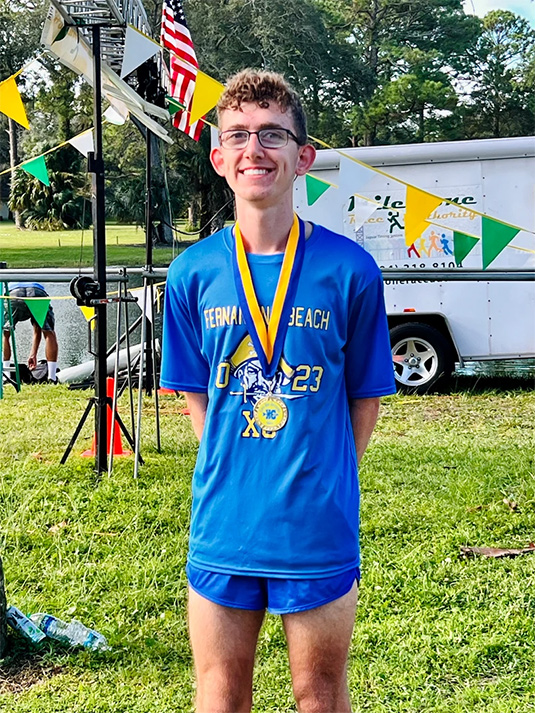 Top 15 finisher at local Coach Hope meet junior year